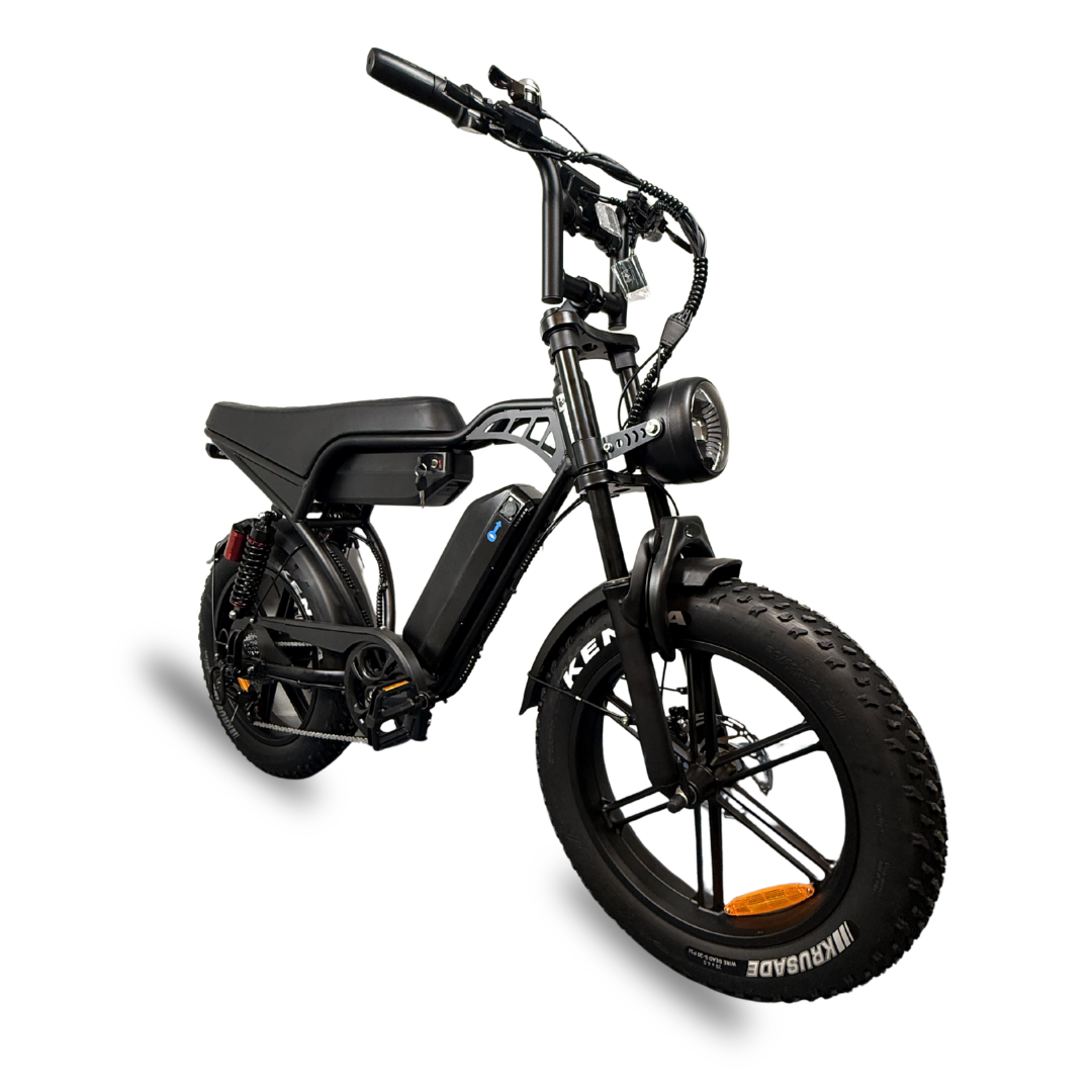 QMWheel V29 Pro Dubbele Accu fatbike in zwart, schuin vooraanzicht met ronde koplamp en brede Kenda banden